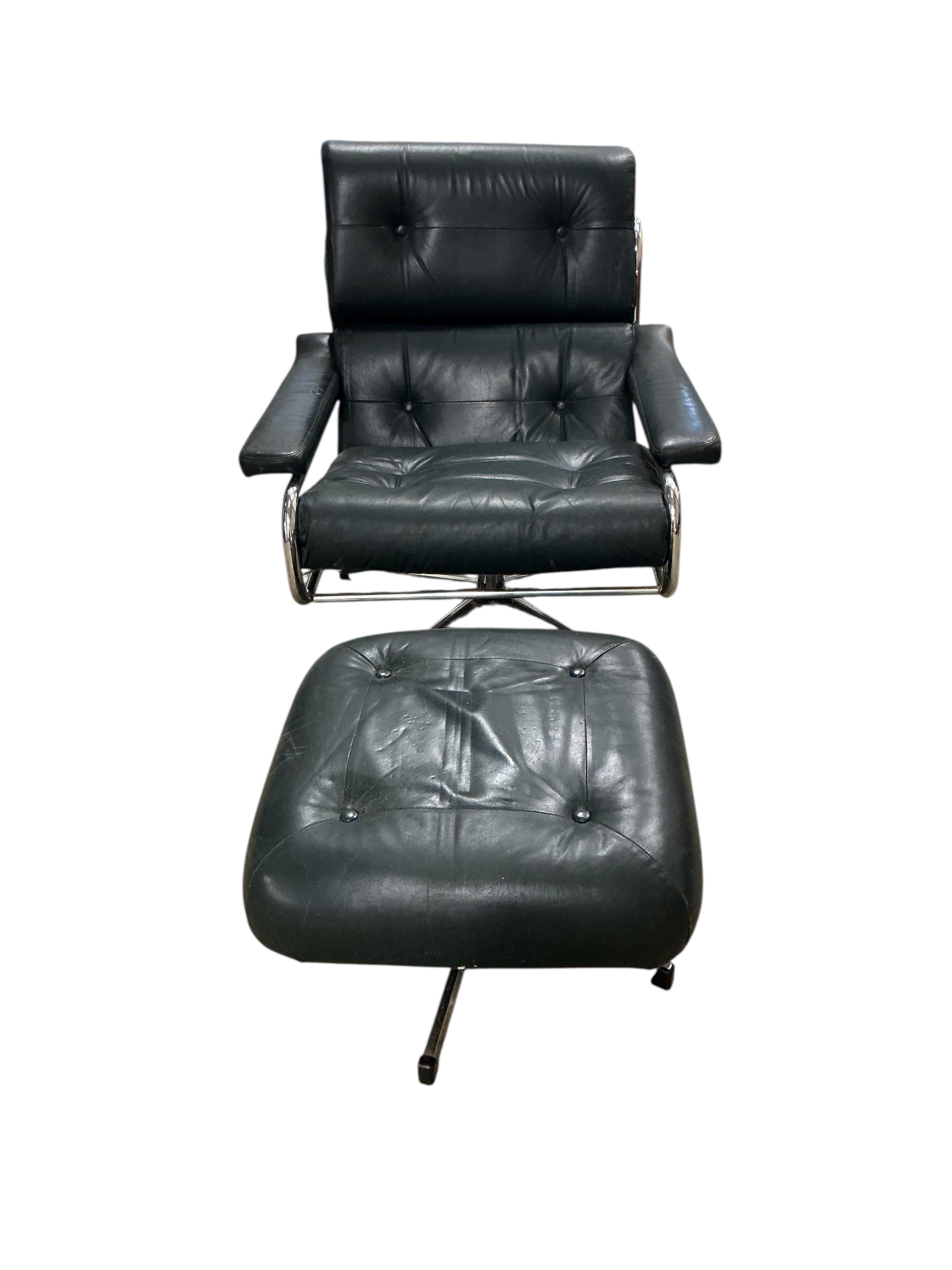 A near pair of mid century Pieff black and green leather swivel lounge chairs on chrome five prong bases, width 86cm, depth 94cm, height 91cm, one with a footstool